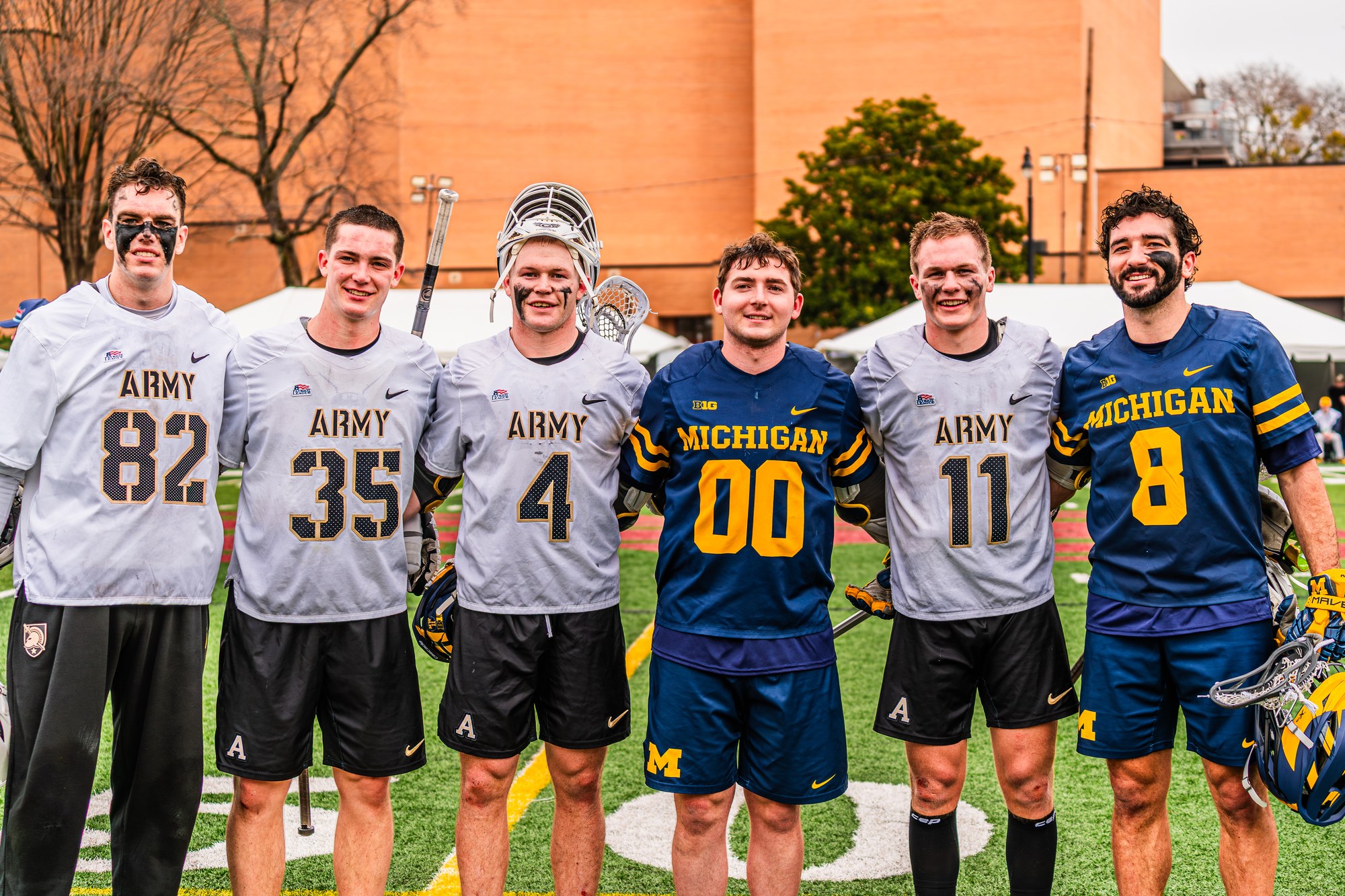 Army and Michigan lacrosse players together after competing at a 285 event
